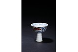 A BLUE AND WHITE UNDERGLAZED RED STEM CUP