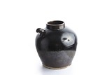 A BLACK GLAZED EWER