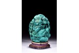 A TURQUOISE CARVED 'DEEP MOUNTAIN' BOULDER