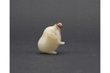 A WHITE AND RUSSET JADE 'PIG' SNUFF BOTTLE