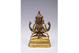 A GILT-BRONZE FIGURE OF FOUR-ARMED BODHISATTVA