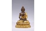 A GILT-BRONZE FIGURE OF SEATED AMITABHA