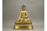 A GILT BRONZE FIGURE OF SEATED SHAKYAMUNI
