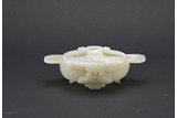 A WHITE JADE 'BAT' WASHER