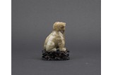 A JADE CARVED MYTHICAL BEAST WITH STAND