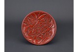 A CINNABAR LACQUER 'PEONY' DISH