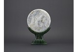 A WHITE AND GREY JADE CARVED LANDSCAPE CIRCULAR TABLE SCREEN