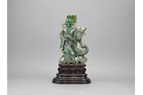 A LARGE JADEITE CARVED 'MAGU' FIGURE ON STAND