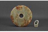 AN ARCHAIC JADE DISC BI AND HORSE-HOOF JADE ORNAMENT