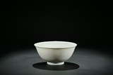 A WHITE GLAZED INCISED 'BOYS' BOWL