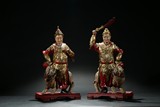 A PAIR OF LACQUERED RED AND GILT CELESTIAL WARRIORS