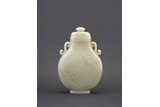 A WHITE JADE 'EIGHT BUDDHIST EMBLEM' MOONFLASK