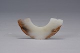 A WHITE JADE PENDANT HUANG