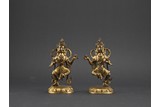A PAIR OF TIBETAN GILT BRONZE DEITIES