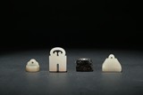 A GROUP OF FOUR CARVED JADE SEALS