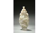 A FINELY CARVED WHITE JADE 'DRAGON' VASE AND COVER