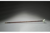 A CHINESE BAMBOO STICK WITH WHITE JADE BIRD ORNAMENT
