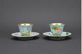 A PAIR OF FAMILLE ROSE 'LOTUS' CUPS AND HOLDERS