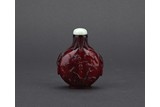 A RUBY RED GLASS 'EAGLE AND BEAR' SNUFF BOTTLE