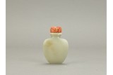 A WHITE JADE 'SASH TIED' SNUFF BOTTLE WITH CORAL STOPPER