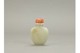A WHITE JADE 'SASH TIED' SNUFF BOTTLE WITH CORAL STOPPER