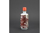 AN UNDERGLAZE RED 'DRAGON' SNUFF BOTTLE