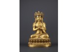 A LARGE GILT BRONZE FIGURE OF VAIROCANA
