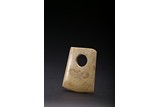 A CALCIFIED JADE AXE ‘TAOTIE’ BLADE