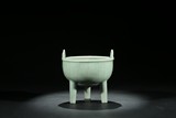 A CHINESE CELADON GLAZE TRIPOD CENSER