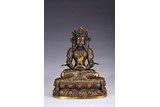 A PARCEL-GILT BRONZE FIGURE OF AMITAYUS