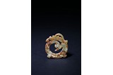 AN ARCHAIC 'DRAGON' JADE PENDANT