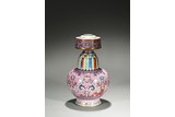 A FAMILLE ROSE PINK GROUND TIBETAN-STYLE ALTAR VASE