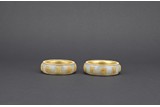 A PAIR OF WHITE JADE GOLD BEAD INLAID 'SHOU' BANGLES