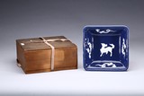 A BLUE GROUND AND WHITE GLAZED 'QILIN' SQUARE DISH