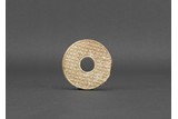 A CALCIFIED 'GRAIN' JADE DISC BI