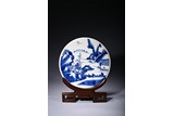 A BLUE AND WHITE PORCELAIN 'LANDSCAPE' CIRCULAR PANEL