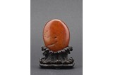 AN AGATE NATURALISTIC ‘EGG’ BOULDER WITH ZITAN STAND