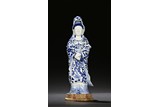 A BLUE AND WHITE FIGURE OF STANDING GUANYIN