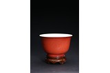A CORAL-RED GLAZED BOWL
