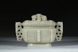 A CARVED JADE ARCHAISTIC VESSEL