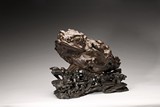 A VERY LARGE AND RARE ALOESWOOD CARVING OF TOAD WITH STAND