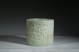 A LARGE WHITE JADE 'LANDSCAPE' BRUSHPOT