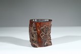 A HUANGHUALI CARVED 'LANDSCAPE' BRUSHPOT