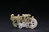 A CARVED JADE 'DRAGON AND PHOENIX' PENDANT