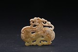 A CARVED JADE DRAGON-SHAPE PENDANT