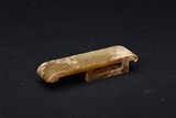 A CARVED JADE SWORD SLIDE