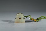 A WHITE JADE 'PAVILION ROOF' SEAL