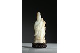 A WHITE JADE FIGURE OF GUANYIN