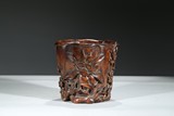 A CARVED HUANGHUALI 'FLOWER' BRUSHPOT
