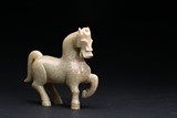 A CELADON JADE FIGURE OF A HORSE